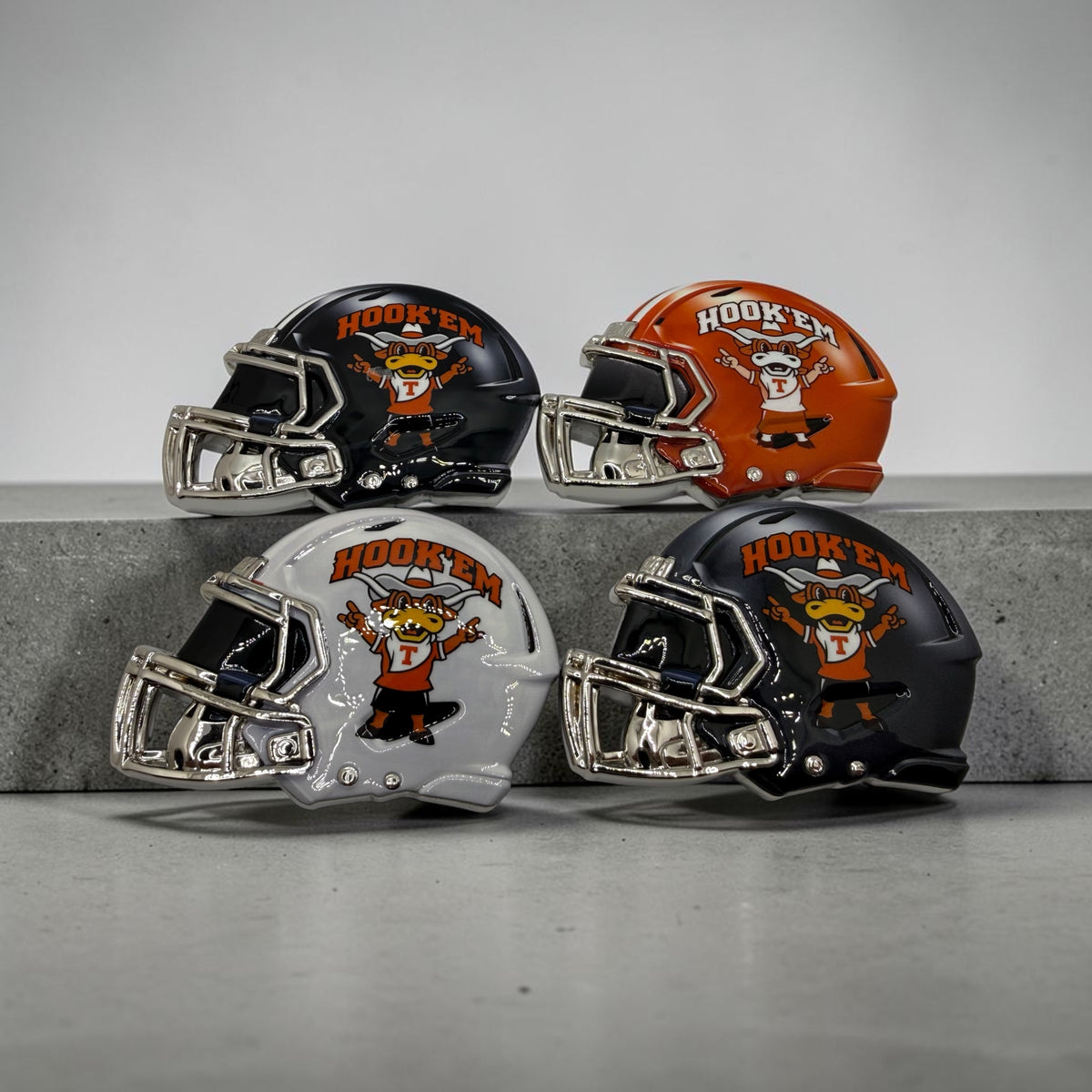 Hook’ Em longhorn mini helmets